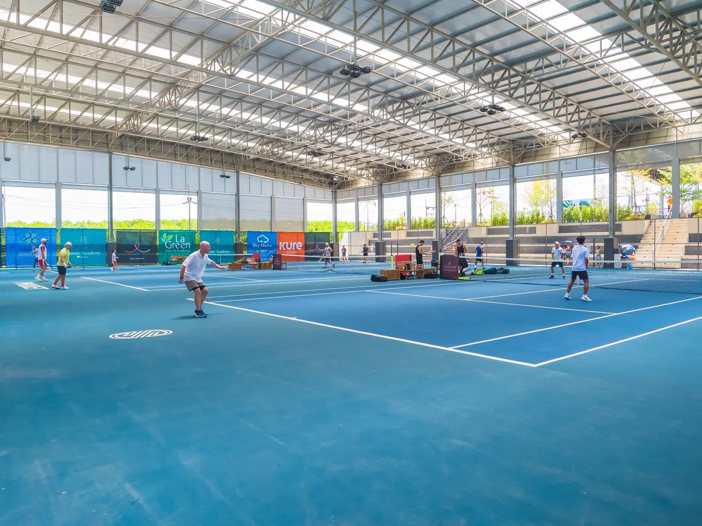 A doubles rally in play at the KĀHLĪ Tennis Academy, Cherngtalay
