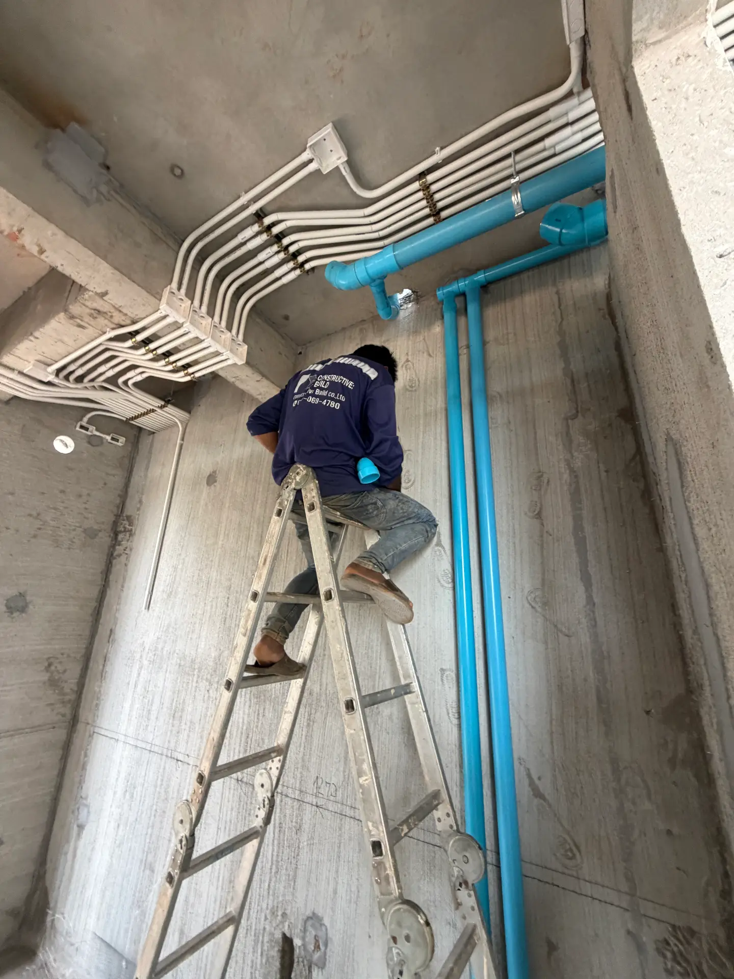 Neatly run electrical conduit and plumbing first-fix inside a KĀHLĪ Phuket villa