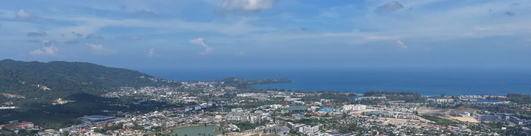 The coast between Layan and Bang Tao seen from the air, near KĀHLĪ Phuket