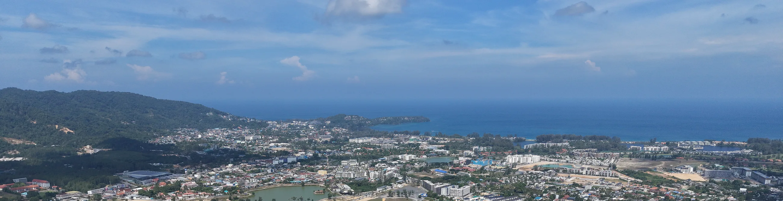 The coast between Layan and Bang Tao seen from the air, near KĀHLĪ Phuket