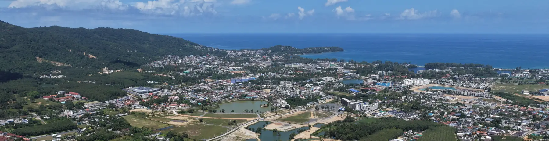 The coast between Layan and Bang Tao seen from the air, near KĀHLĪ Phuket