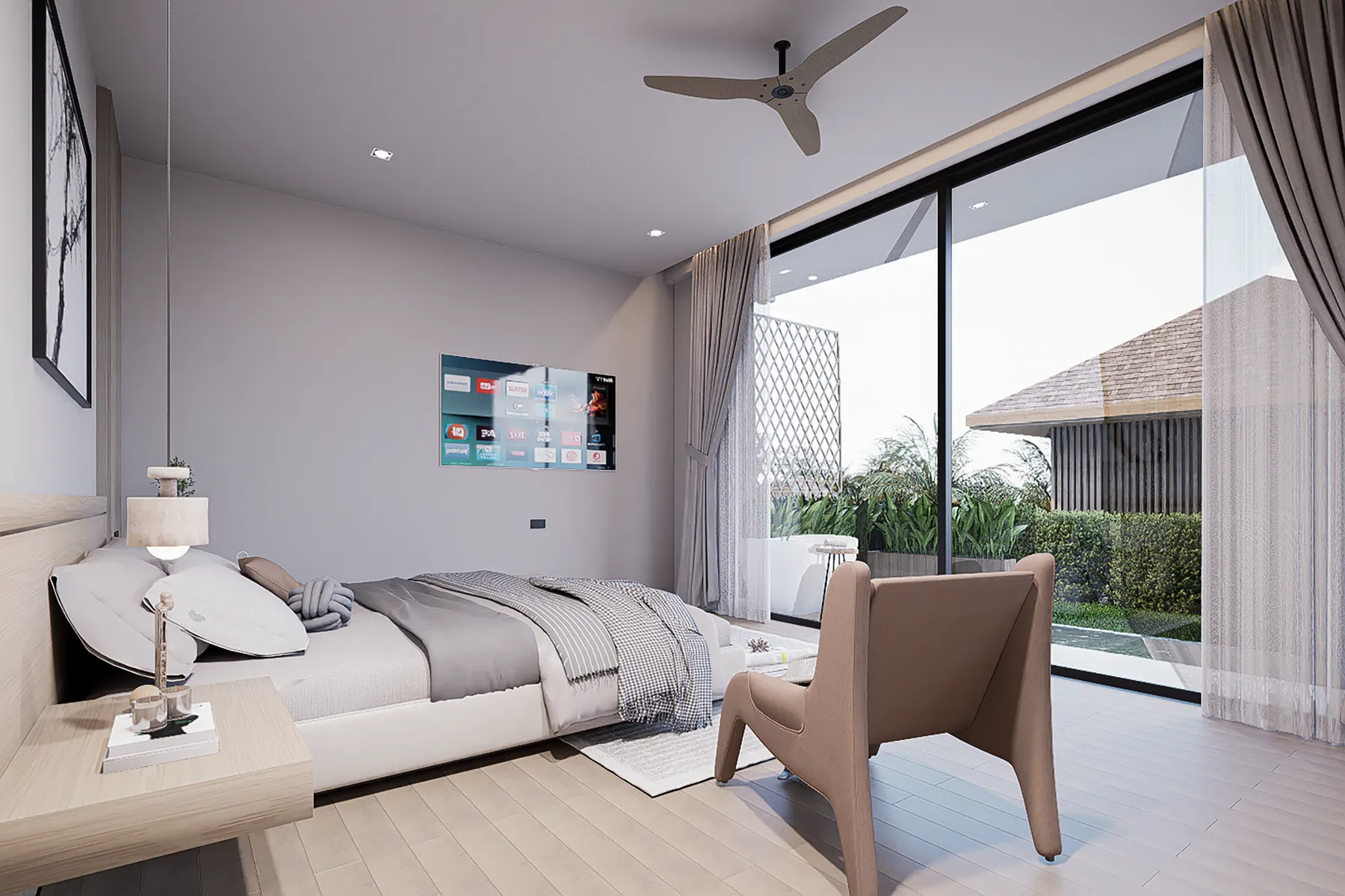 ห้องนอนชั้นล่างที่เปิดออกสู่สวน วิลล่า 18 ที่ KĀHLĪ Hillside