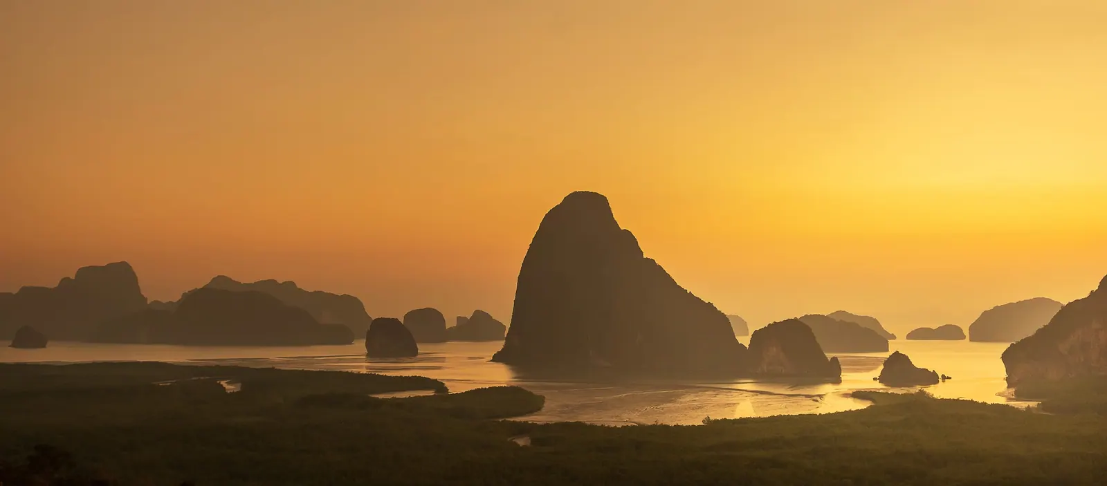 Phang Nga Bay limestone islands at sunset, a day trip from Cherngtalay, Phuket